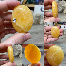 Load image into Gallery viewer, Orange Calcite Pillow Palm Stones
